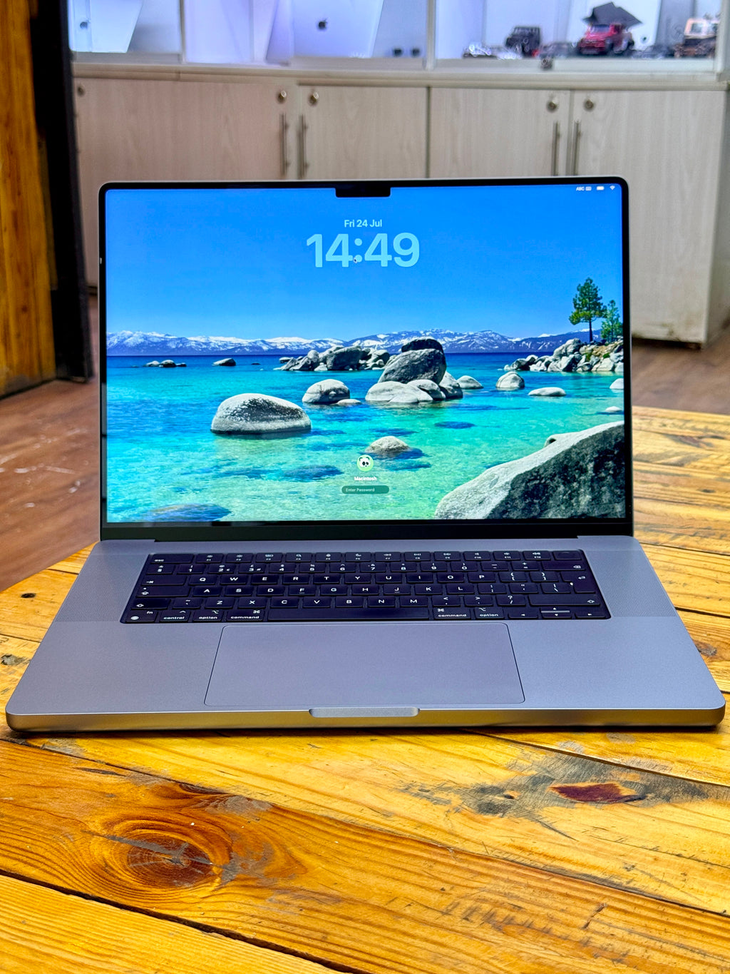 Apple MacBook Pro 2021 M1 Pro laptop with 16GB RAM and 512GB SSD, open displaying keyboard and screen.